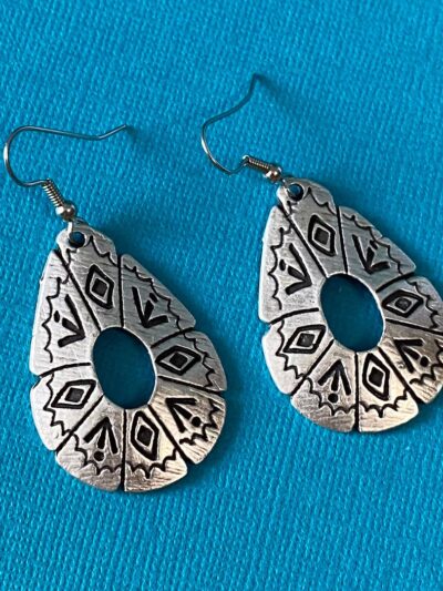 Large silver earrings with southwestern symbols