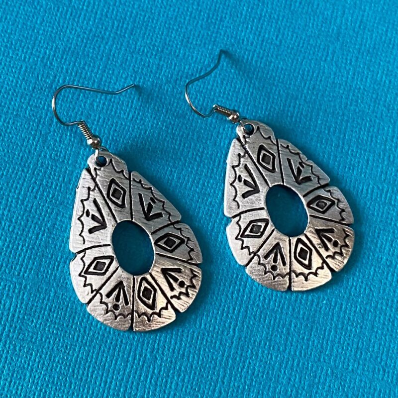 Large silver earrings with southwestern symbols