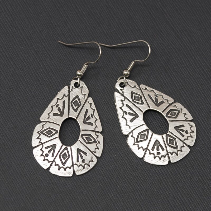 Large silver earrings with southwestern symbols