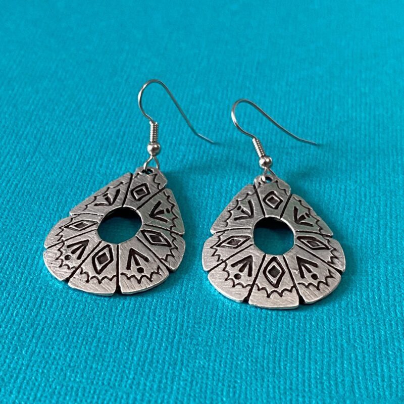 Large silver earrings with southwestern symbols