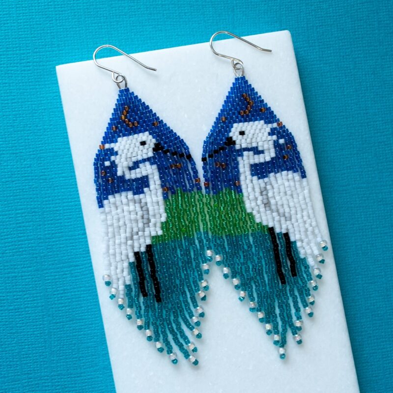 Beaded fringe earrings with a white egret
