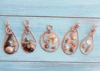 Copper pendants with seashells