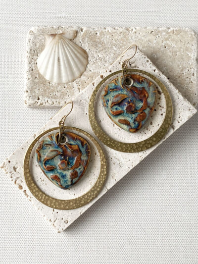 Blue and Brown ceramic charm and hammered raw brass hoop earrings.