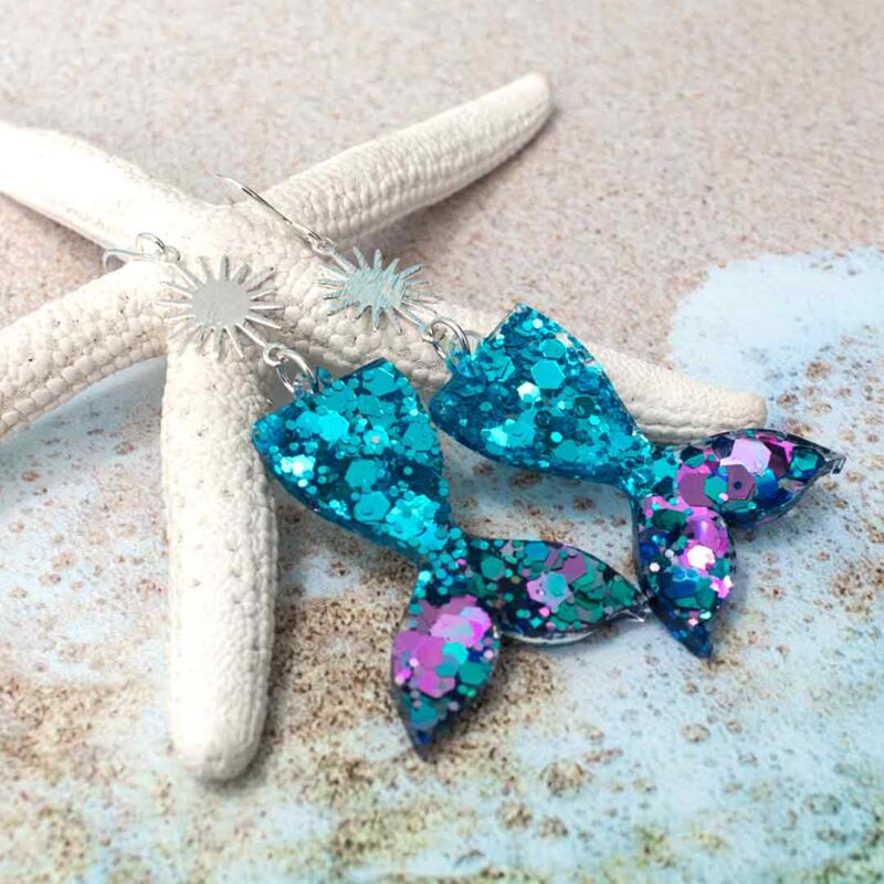Purple and turquoise blue glitter mermaid earrings.