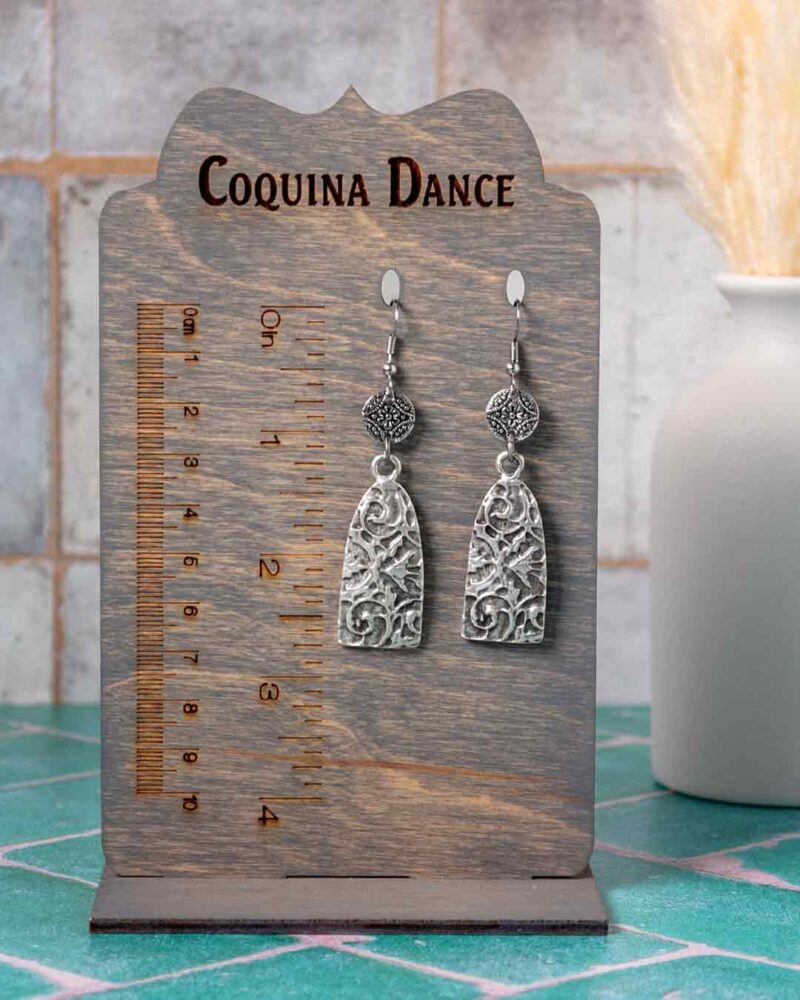 Earrings shown on stand showing measurements.