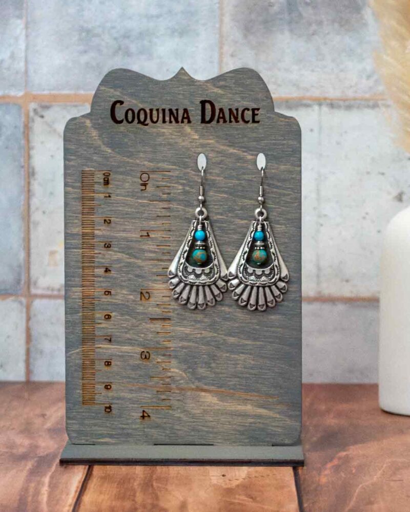 Earrings shown on stand showing measurements.