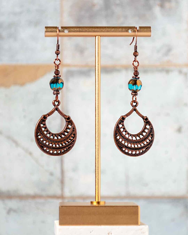 Earrings hanging from earring stand.