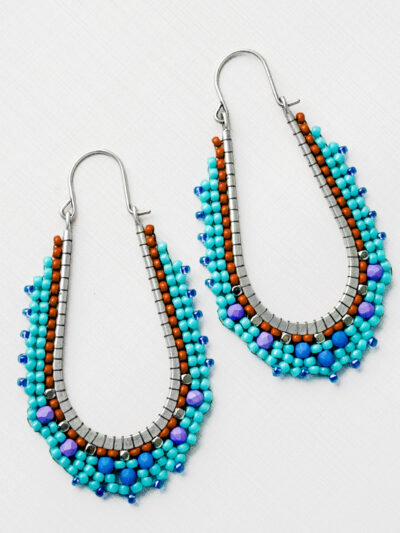 Beaded brass hoop earrings with turquoise, brick, blue and purple glass beads in circular brick stitch pattern, handmade in Port Aransas, Texas